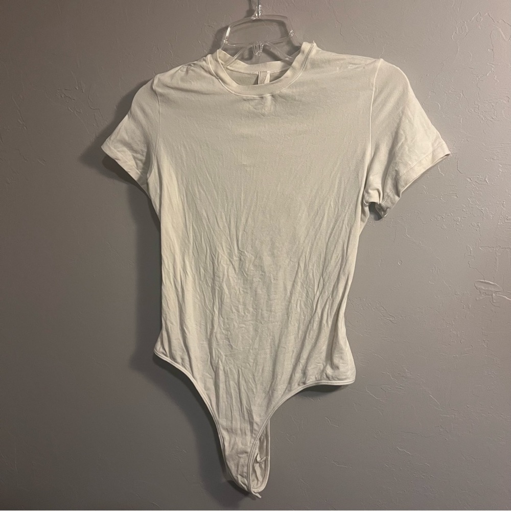 SKIMS Short Sleeve Crew Bodysuit in Ivory Cream - Picture 5 of 16